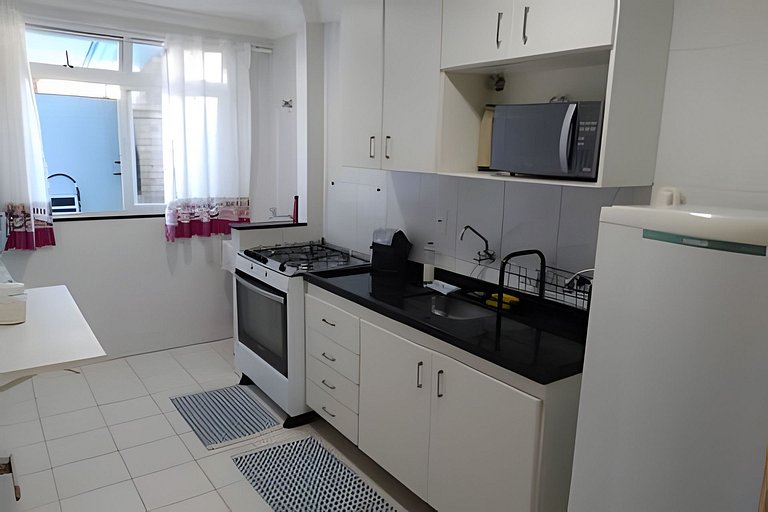 Covered apartment with barbecue gourmet area, ample space.